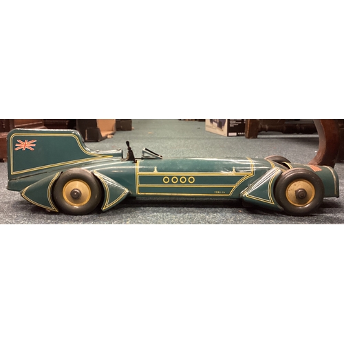 215 - An unusual boxed vintage toy model of a Bluebird land speed car. Est. £250 - £300.