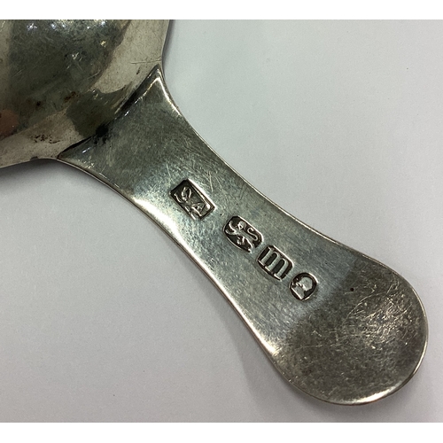 100 - A Georgian silver caddy spoon with bright-cut decoration to terminal. London 1827. Approx. 11 grams.... 