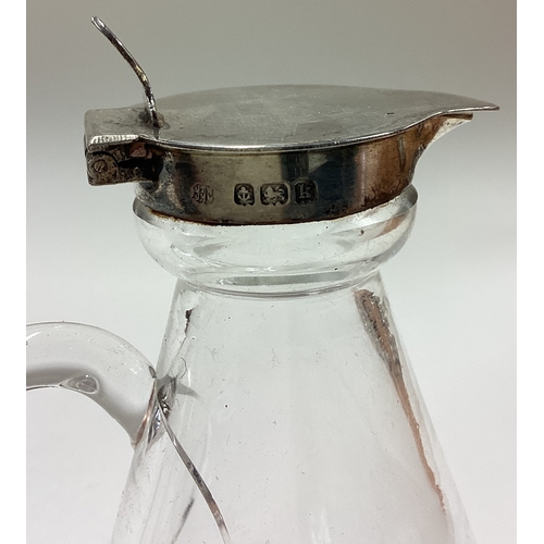 11 - A silver mounted and glass whisky noggin. Birmingham 1912. Est. £30 - £40.