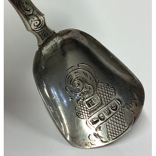 114 - A Victorian silver caddy spoon with bright-cut decoration. Birmingham 1856. By Thomas Davenport. App... 