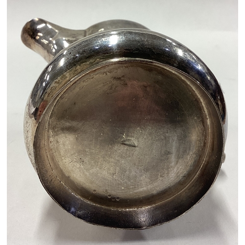 118 - A 19th Century Chinese export silver jug with embossed decoration. Approx. 152 grams. Est. £150 - £2... 