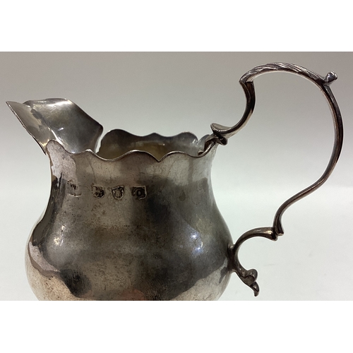 119 - An 18th Century George III silver jug. Approx. 88 grams. Est. £80 - £120.