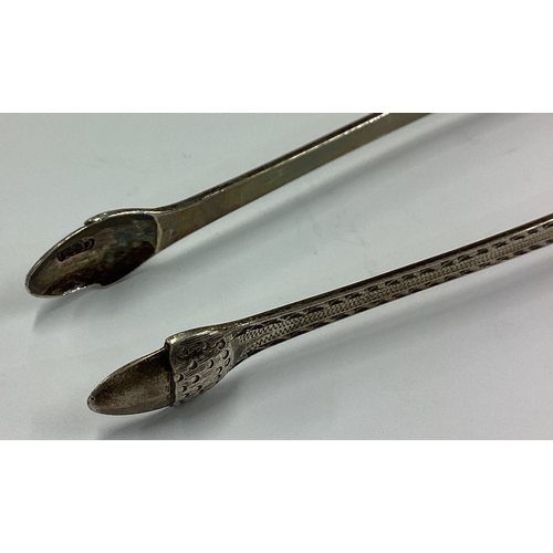 135 - A pair of 18th Century silver ice tongs with acorn decoration. Maker and lion mark only. Approx. 26 ... 