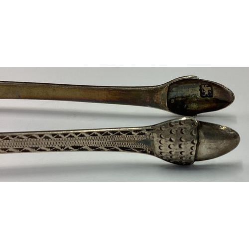 135 - A pair of 18th Century silver ice tongs with acorn decoration. Maker and lion mark only. Approx. 26 ... 