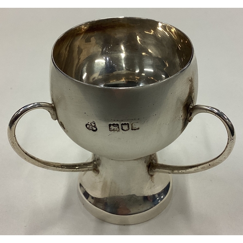 142 - A stylish silver three-handled tyg. London. Approx. 56 grams. Est. £30 - £50.