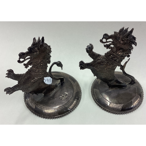 146 - A fine pair of novelty Victorian silver menu holders in the form of Naturalistic dragons. Birmingham... 