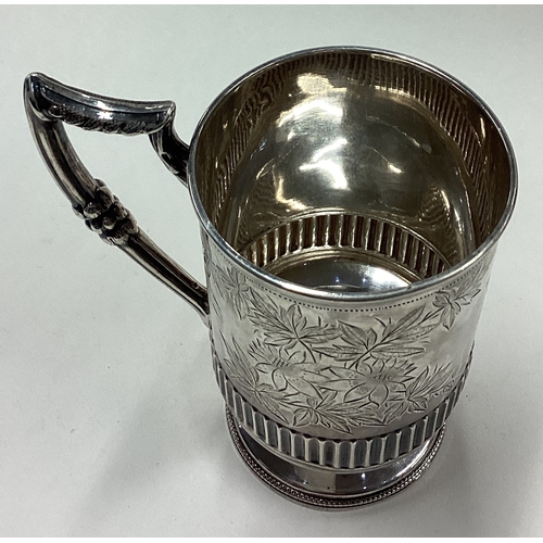 180 - A novelty Victorian silver christening mug finely engraved with floral decoration. Birmingham 1888. ... 