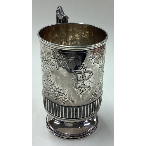 180 - A novelty Victorian silver christening mug finely engraved with floral decoration. Birmingham 1888. ... 