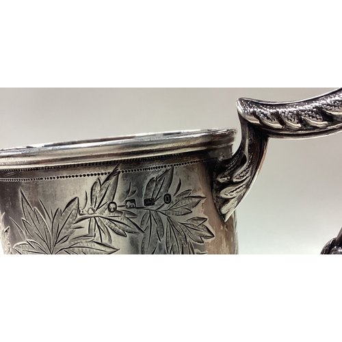 180 - A novelty Victorian silver christening mug finely engraved with floral decoration. Birmingham 1888. ... 