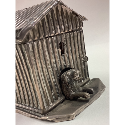 187 - A silver money box in the form of a dog kennel. Approx. 100 grams. Est. £100 - £150.