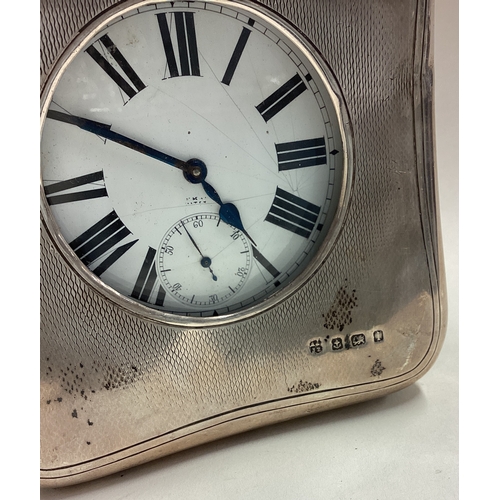 189 - A large silver travelling pocket watch in silver mounted case. Birmingham 1910. Est. £100 - £150.