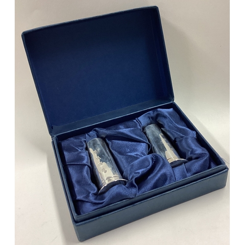 190 - A fine boxed pair of Modernistic silver peppers in the form of shotgun cartridges. Birmingham 1995. ... 