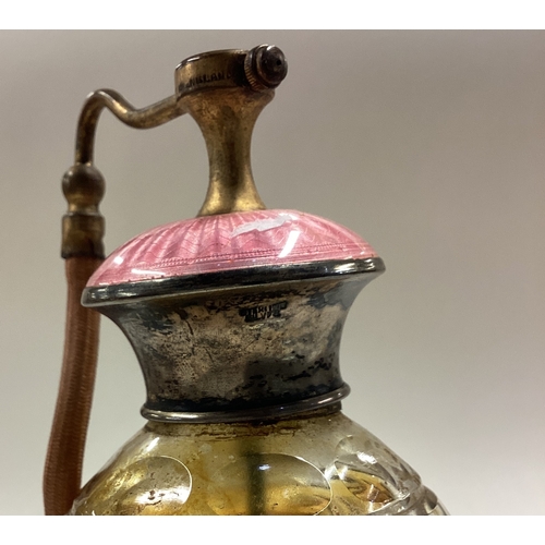 192 - A Sterling silver and pink enamelled perfume bottle. Est. £30 - £40.