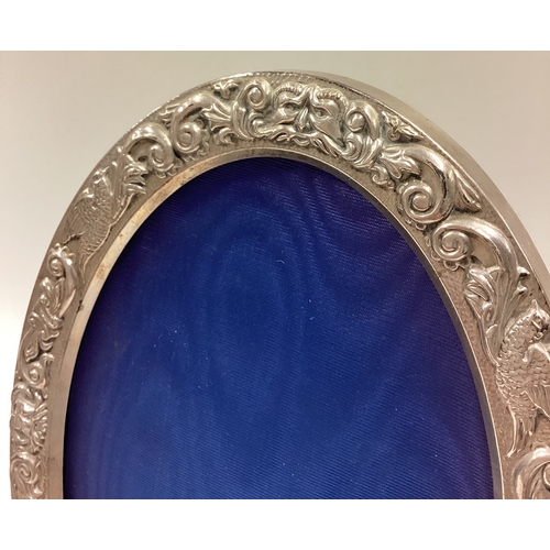 197 - A fine pair of chased silver photo frame embossed with floral decoration. Birmingham 1991. Est. £50 ... 