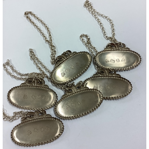 205 - A set of six silver wine labels. London 1969. Approx. 88 grams. Est. £80 - £120.