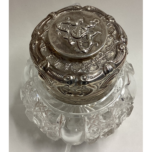 208 - A chased silver mounted and glass inkwell bearing Royal crest. London 1901. By Joseph Gloster & Sons... 