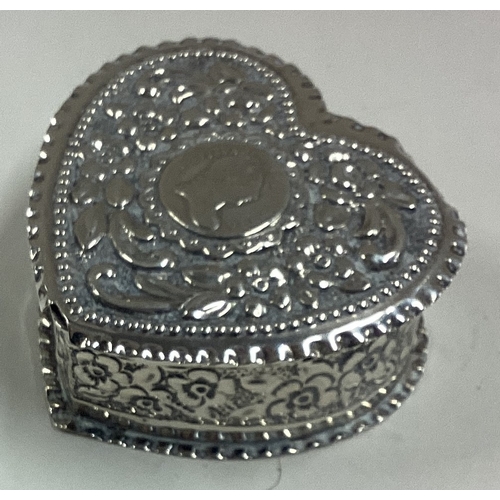 218 - A heart-shaped silver pill box with engraved decoration bearing English import marks. Approx. 34 gra... 