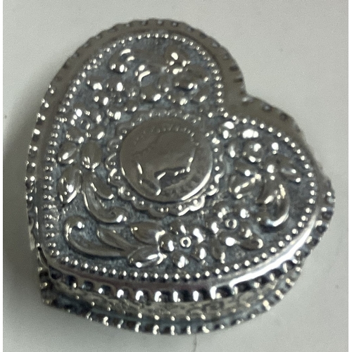 218 - A heart-shaped silver pill box with engraved decoration bearing English import marks. Approx. 34 gra... 