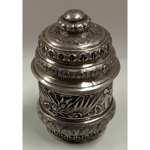 219 - A Chinese silver pill box and cover embossed with dragons. Circa 1900. Approx. 71 grams. Est. £100 -... 