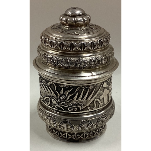 219 - A Chinese silver pill box and cover embossed with dragons. Circa 1900. Approx. 71 grams. Est. £100 -... 