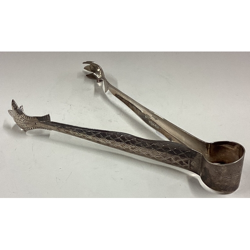 221 - A large pair of Asian silver ice tongs. Approx. 51 grams. Est. £60 - £80.