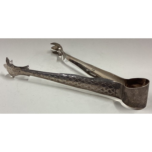 221 - A large pair of Asian silver ice tongs. Approx. 51 grams. Est. £60 - £80.