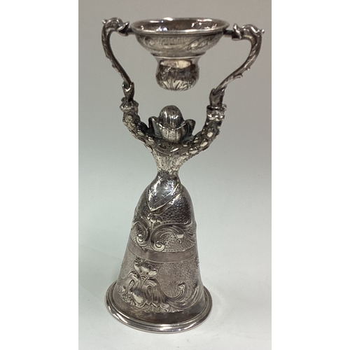 233 - A Victorian silver lady's wager cup of realistic form chased with foliage decoration bearing English... 