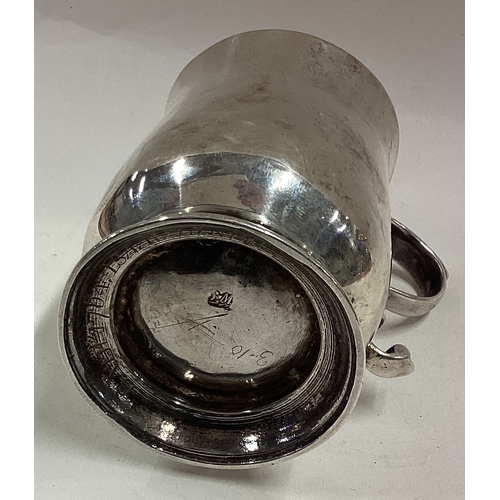 259 - An 18th Century Provincial silver mug. Marked to base. Approx. 109 grams. Est. £150 - £200.