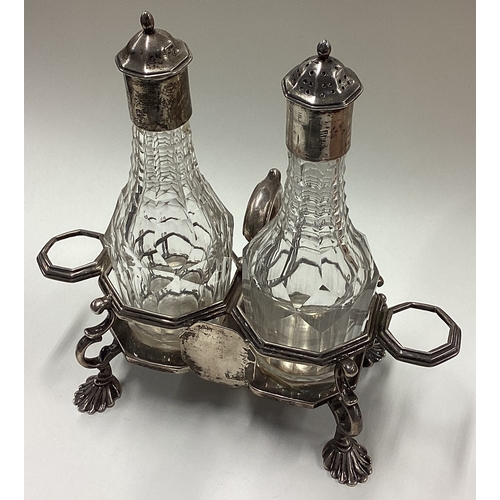 27 - A rare 18th Century silver mounted and glass oil and vinegar set. London 1761. By RP. Approx. 455 gr... 