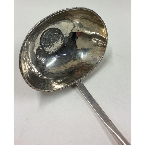 275 - A large 19th Century silver toddy ladle with coin inset to centre. Approx. 51 grams. Est. £50 - £80.