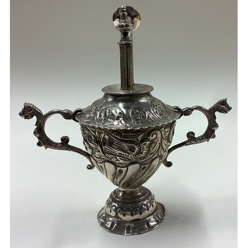 31 - A rare Victorian silver table lighter with embossed decoration. London 1894. By William Comyns. Appr... 