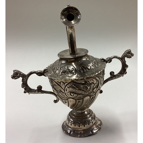 31 - A rare Victorian silver table lighter with embossed decoration. London 1894. By William Comyns. Appr... 