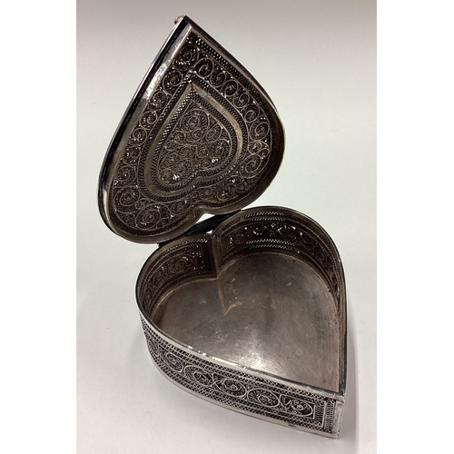 33 - A rare late 19th Century Indian silver heart-shaped snuff box with filigree and pierced decoration. ... 