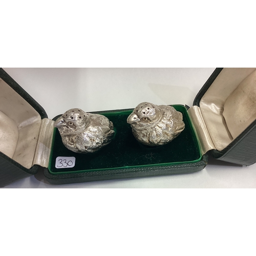 330 - An attractive boxed pair of cast silver peppers in the form of chicks. London. Approx. 57 grams. Est... 