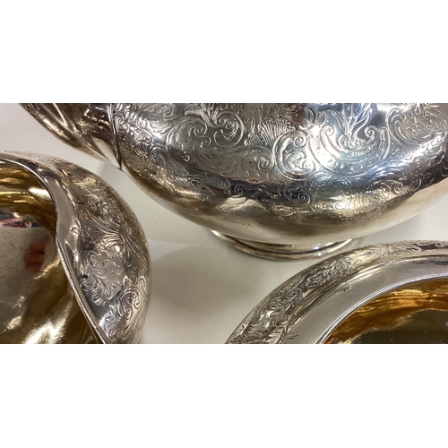 334 - A good Victorian silver three-piece tea service. London. By WC. Approx. 888 grams. Est. £300 - £400.