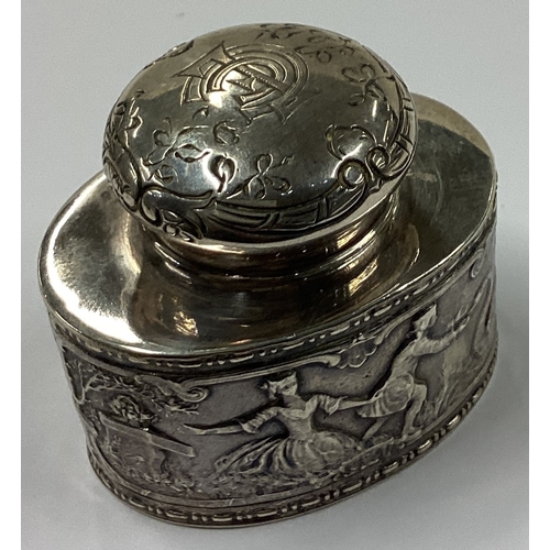 339 - A novelty Victorian silver tea caddy embossed with figures bearing import marks. Marked to base. By ... 