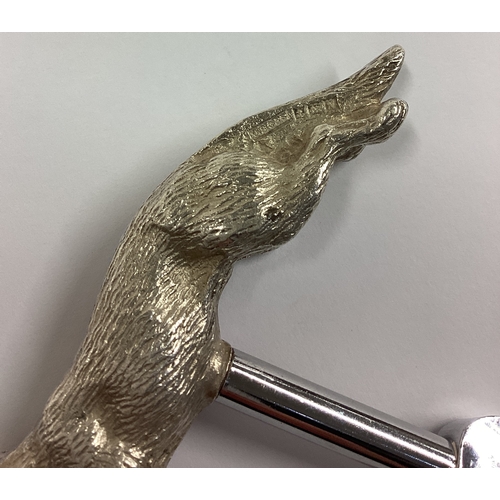 344 - A novelty silver bottle opener cast with fox. Birmingham 1962. Approx. 94 grams. Est. £200 - £300.