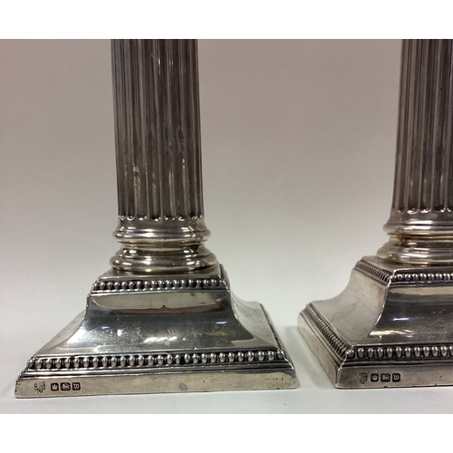 345 - A large pair of silver Corinthian candlesticks. Sheffield 1914. By Hawksworth Eyre & Co Ltd. Approx.... 