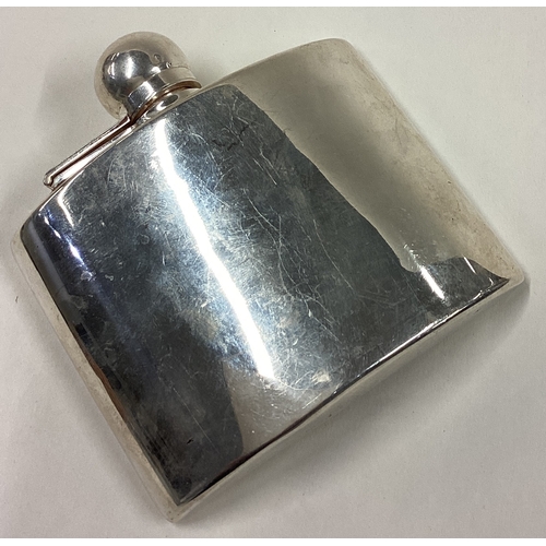 356 - A curved silver hip flask with screw-top cover. London 1905. Approx. 134 grams. Est. £200 - £300.