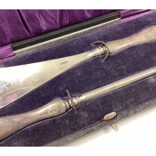 357 - A silver shoe horn set. Birmingham. Est. £80 - £120.