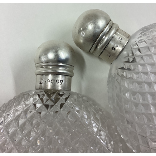 358 - A pair of 'His and Hers' Victorian silver and glass drinking flasks. Est. £200 - £300.