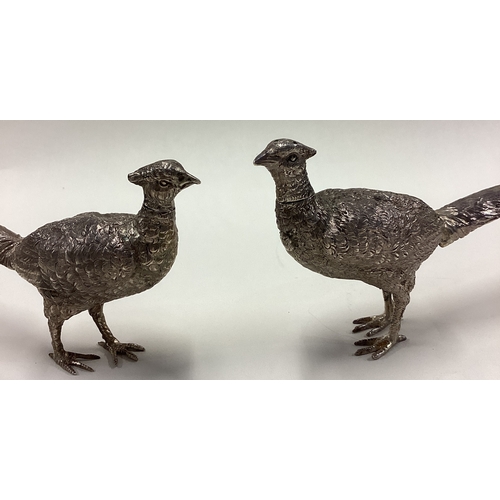 379 - A pair of silver figural peppers in the form of pheasants bearing English import marks. Circa 1910. ... 