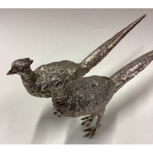 379 - A pair of silver figural peppers in the form of pheasants bearing English import marks. Circa 1910. ... 