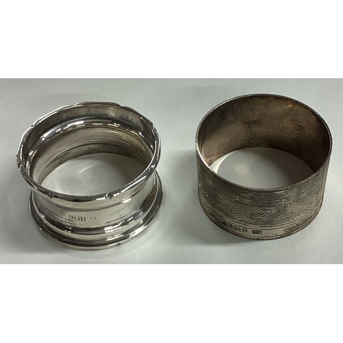 39 - Two heavy silver napkin rings. Approx. 55 grams. Est. £20 - £30.