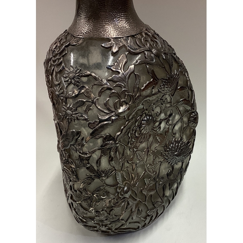 391 - A 19th Century / early 20th Century export silver overlaid decanter. Marked Sterling & maker to base... 