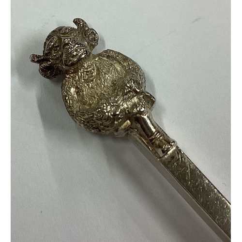 404 - A large silver spoon mounted with a Lincoln Imp. Approx. 54 grams. Est. £40 - £60.