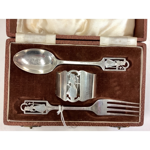 412 - A novelty 20th Century silver three-piece christening knife, fork and spoon set pierced with 'Red Ri... 