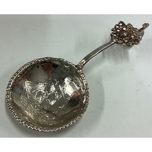 416 - A 19th Century Continental silver caddy spoon embossed with yacht decoration to bowl. Approx. 22 gra... 