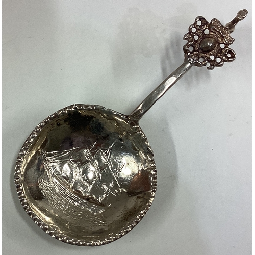 416 - A 19th Century Continental silver caddy spoon embossed with yacht decoration to bowl. Approx. 22 gra... 