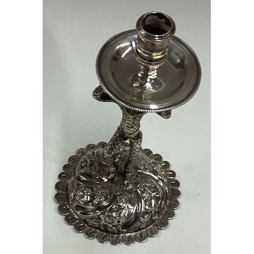 417 - An Antique silver figural taperstick in the form of a harlequin. Approx. 101 grams. Est. £300 - £400... 